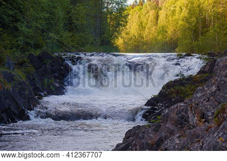 The Upper Threshold Of The Kivach Waterfall On A Sunny June Evening. Karelia, Russia