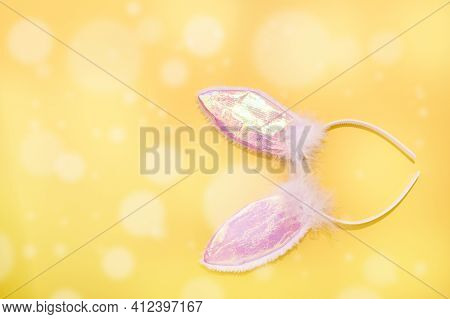 Spring. Easter Pink Bunny Ears On A Yellow Background. Free Space For Text. Copy Space. Vertical For