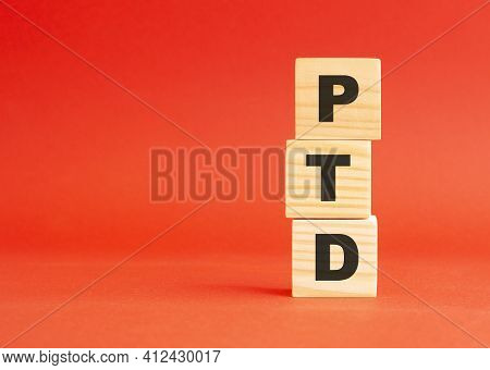 Wooden Cubes With Word Ptd. For Your Design And Concept. Wooden Cubes On A Red Background. Free Spac