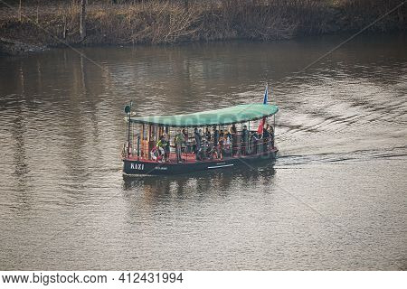 Prague, Czech Republic - February 24, 2021. Retro Ferry Boat With Passengers Sailing On Moldau River