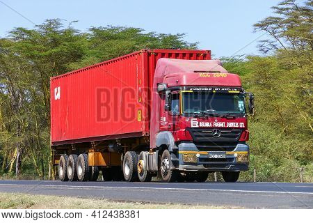Nakuru County, Kenya - January 31, 2021: Red Semitrailer Truck Mercedes-benz Axor 2543 At The Interu