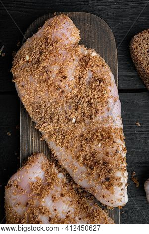 Crispy Garlicky Chicken Raw Ingredient, On Black Wooden Background, Top View