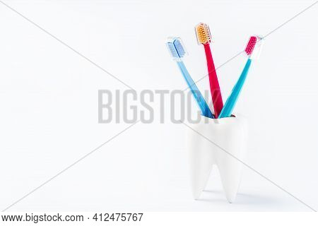 Teeth Model With A Brush And Toothpaste. Dental Care. Dental Accessories On A White Background.