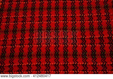 Background Of An Old Worn Carpet Sewn With Thick Threads.