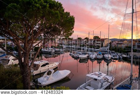 View On Houses, Roofs, Canals And Boats In Port Grimaud, Var, Provence, France During Sunset