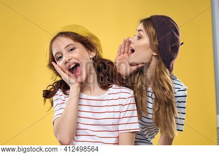 Funny Mom And Daughter Wearing Hats Fashion Fun Joy Family Yellow Background