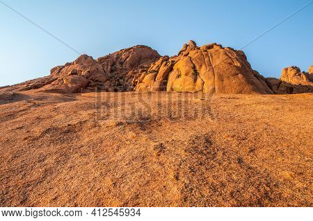 Pontok Mountains Near Spitzkoppe. Red Vivid Granite Rock Formation In Namib Desert At Sunset Time, N