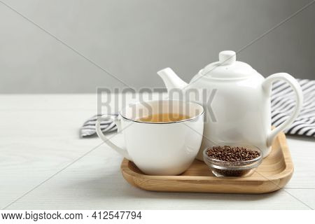 Buckwheat Tea And Granules On White Wooden Table. Space For Text