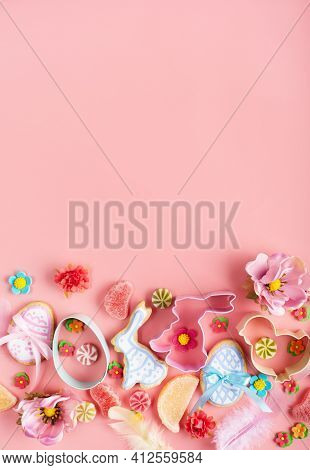 Candies, Cookie Cutters, Easter Frosted Cookies In Shape Of Egg, Rabbit And Chicken On Pink Backgrou
