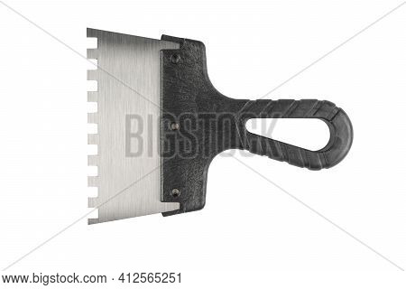 New Trowel For Tiles Isolated On White Background. Notched Trowel Isolated Over White.