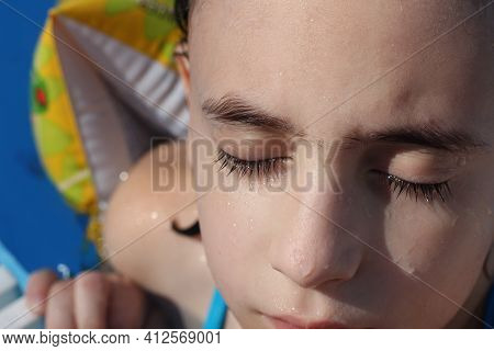 The Girls Face With Fused Eyebrows. Monobrow. Wide Bushy Eyebrows