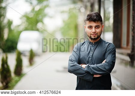 Сonfident Pakistani Indian Muslim Arabic Boy In Grey Kameez Shalwar Suit.