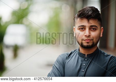 Сonfident Pakistani Indian Muslim Arabic Boy In Grey Kameez Shalwar Suit.