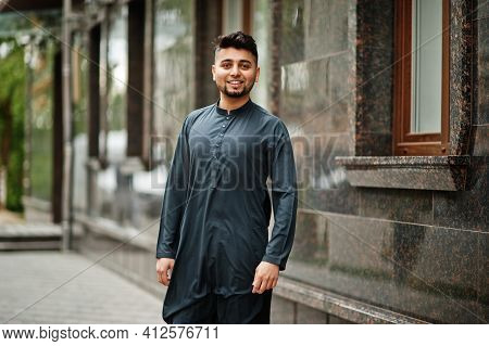 Сonfident Pakistani Indian Muslim Arabic Boy In Grey Kameez Shalwar Suit.