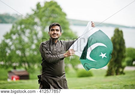 Indo Pakistani Man Wear Traditional Clothes Achkan Or Sherwani With Pakistan Flag.