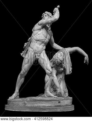 Ancient sculpture of gaul killing himself and his wife. Marble man and woman statue isolated on black background