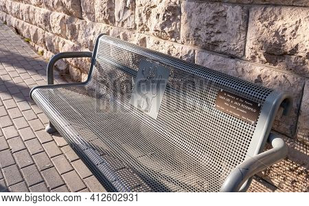 Jerusalem, Israel, February 27, 2021 : Evening View Of A Metal Public Bench With The Coat Of Arms Of