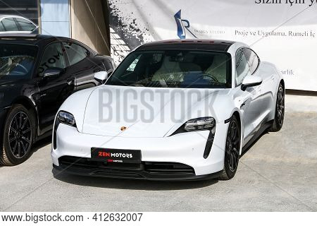 Istanbul, Turkey - February 11, 2021: Brand New All-electric Car Porsche Taycan In The City Street.