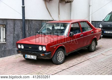 Istanbul, Turkey - February 11, 2021: Red Car Tofas Murat 131 In The City Street.