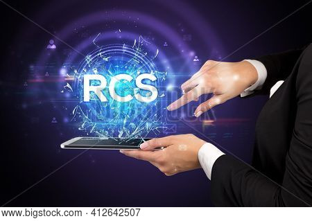 Close-up of a touchscreen with abbreviation.