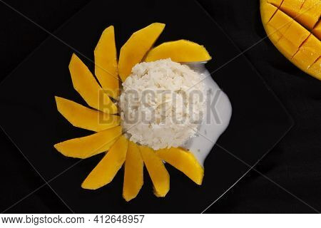 Khao Niew Mamuang, Mango Sticky Rice, Delicious Thai Dessert On Black Background From Above.