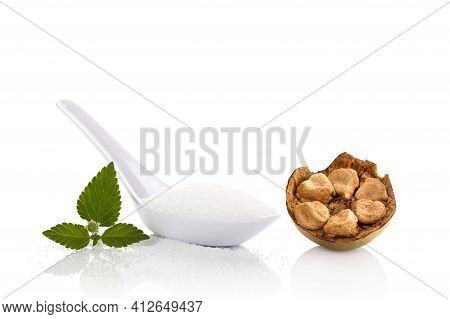 White Crystallized Sugar In White Spoon And Luo Han Guo, Monk Fruit Isolated On White Background.