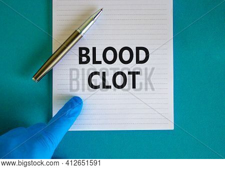Medical And Blood Clot Symbol. Doctor Hand, Metalic Pen. White Note With Words 'blood Clot'. Beautif