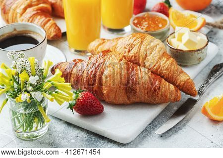 Fresh Sweet Croissants With Butter And Orange Jam For Breakfast. Continental Breakfast On A White Co