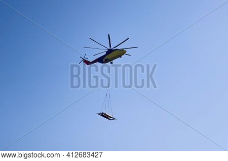 The Worlds Largest Cargo Helicopter Hovers Overhead. Bottom View.the Worlds Largest Cargo Helicopter