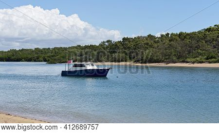 A Fishing Cabin Cruiser For Sale Anchored In A Creek