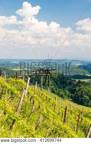 vineyard with windmill called klapotetz in south of Styria, Austria