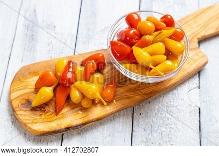 Pickled red and yellow hot chili peppers