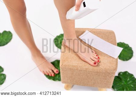 Personal Hygiene : Warm Heater For Wax. Fit Young Woman Waxing Her Legs With A Portable Roll-on Depi