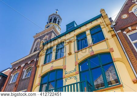 Colorful Old Houses In Front Of The Tower Of Kampen, Netherlands
