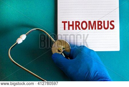 Medical And Thrombus Symbol. Doctor Hand, Stethoscope. White Note With The Word 'thrombus'. Beautifu