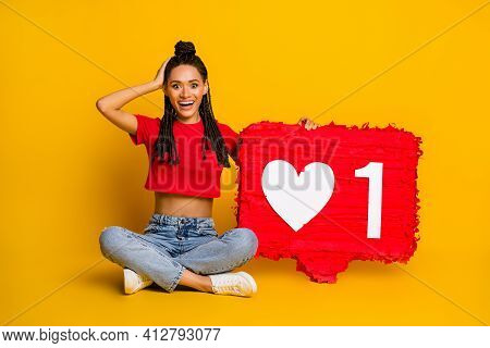 Portrait Of Pretty Amazed Cheerful Girl Sitting Lotus Pose Holding Big Board Like Influenzer Isolate