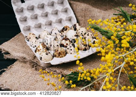 Quail Eggs In Eco-friendly Packaging. The Package Of Quail Eggs Lies On The Burlap.