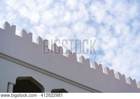 White Building Fascade Carved Roof Edge In Stone Town, Zanzibar