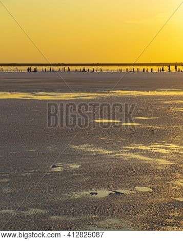 Golden  Sunset Over Syvash Lake. Salt Lake With Healing Mud In The Rays Of The Setting Sun. Beautifu