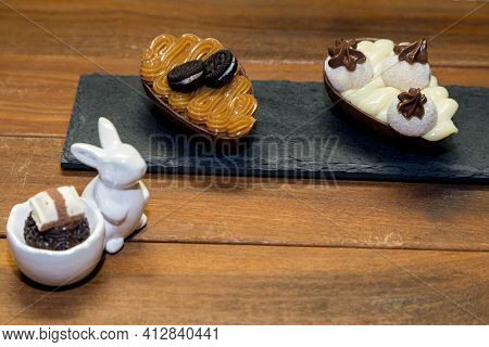 Chocolate Truffle Brigadeiro In Porcelain Rabbit And Chocolate Easter Egg In Plack Stone