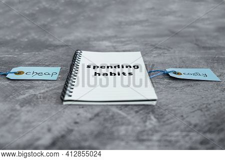 Cheap Vs Costly Prioduct Price Tags Next To Spending Habits Notepad, Money And Consumer Behaviour Co