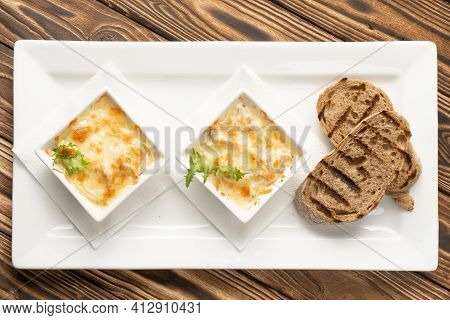 Two Servings Of Julienne With Grilled Ciabatta Slices