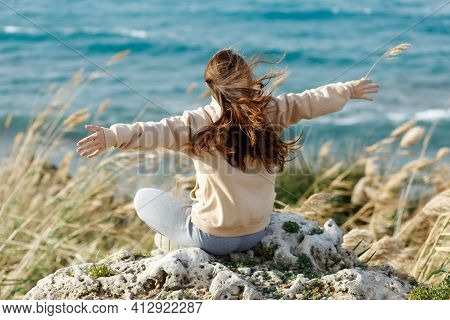 Young Yoga Woman Meditation Open Hands, Mindfulness On Seaside Rock Cliff Edge. Beautiful Sea View. 
