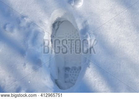 Human Footprints In Deep Snow In Winter