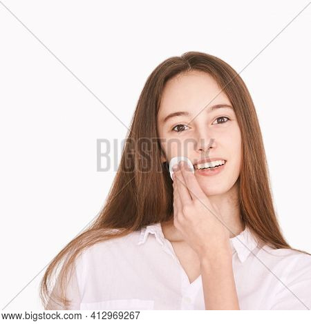 Pretty Girl Indoor Portrait. Light Background. Female Teenager Person. Long Brow Hair. Cleansing Dir
