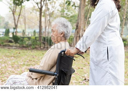 Doctor Help And Care Asian Senior Or Elderly Old Lady Woman Patient Sitting On Wheelchair At Nursing