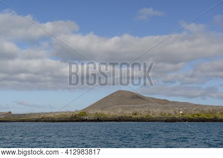 Coastline Of  Floreana Island With A Tourist Area Marker, Galapagos Islands, Ecuador