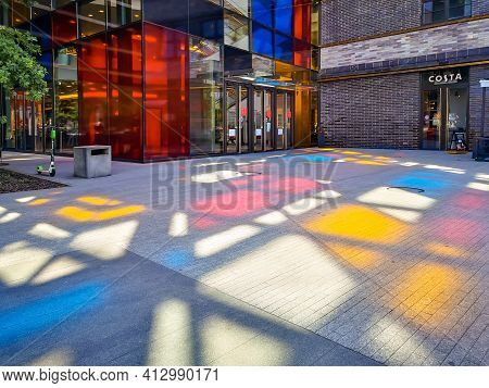 Wroclaw, Poland - May 29 2020: Colorful Shapes On The Ground Made By Shining Sun Behind Colorful Win