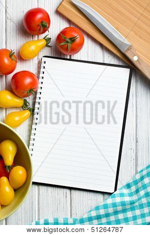 tomatoes with blank recipe book