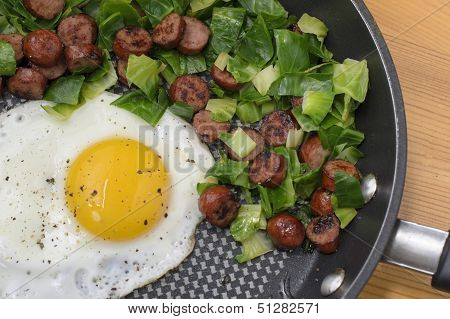 egg sunny side up with brussels and sausage